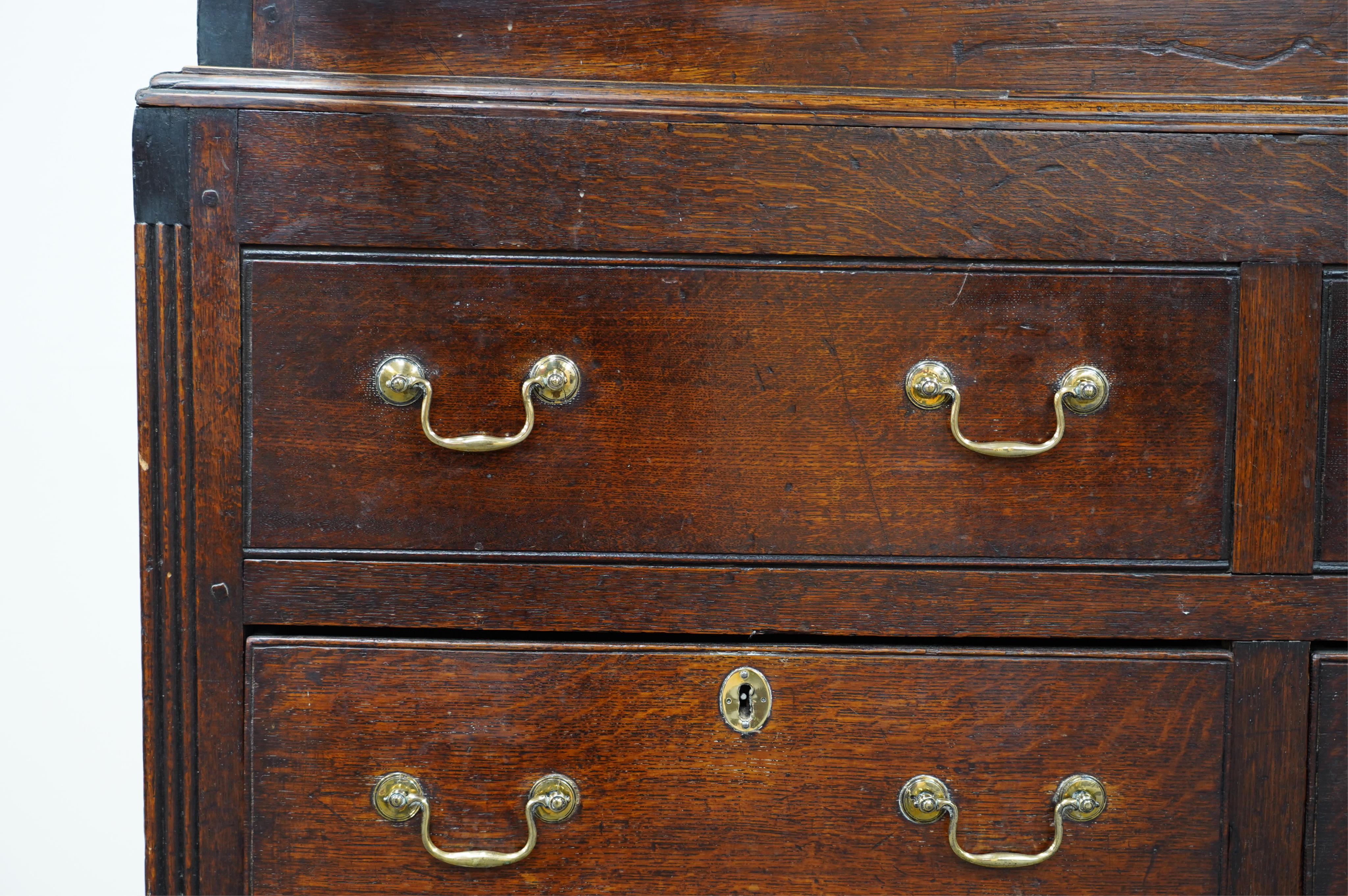 A mid 18th century oak press cupboard